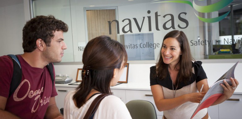 Navitas staff helping students